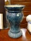 (R2) GREEN ACANTHUS LEAF PATTERN VASE. MEASURES 9 IN X 15 IN. ITEM IS SOLD AS IS WHERE IS WITH NO