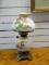 (R2) ANTIQUE OIL LAMP WITH BRASS BASE AND FLORAL PAINTED BODY AND SHADE WITH CHIMNEY. MEASURES 20 IN