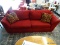 (R2) RED CORDUROY 2 SEAT CUSHION COUCH WITH REMOVABLE CUSHIONS AND 2 SIDE THROW PILLOWS. MEASURES 90