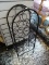 (R2) CAST IRON WINE HOLDING RACK. HOLDS UP TO 18 BOTTLES. ITEM IS SOLD AS IS WHERE IS WITH NO