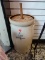 (R2) ANTIQUE BUTTER CROCK WITH DASHER AND LID. MEASURES 23 IN TALL. ITEM IS SOLD AS IS WHERE IS WITH