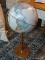 (R1) REPLOGLE GLOBE OF THE WORLD FROM THE WORLD CLASSIC SERIES ON MAPLE STAND. MEASURES 16 IN X 37