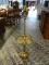 (R1) BRASS FLOOR LAMP WITH BUILT IN END TABLE. MEASURES 53 IN TALL. ITEM IS SOLD AS IS WHERE IS WITH