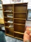 (R1) 10 SHELF DOUBLE BOOKCASE. MEASURES 47.5 IN X 12.5 IN X 76.25 IN. NEEDS TLC. ITEM IS SOLD AS IS