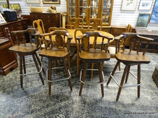 (R1) SET OF 4 PINE SWIVEL BAR CHAIRS WITH LOWER FOOT RESTS. EACH MEASURES 22 IN X 21 IN X 40.5 IN.
