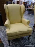 (R2) YELLOW UPHOLSTERED MAHOGANY QUEEN ANNE WING BACK CHAIR. IS 1 OF A PAIR. MEASURES 32 IN X 32 IN
