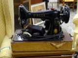 (R2) VINTAGE SINGER SEWING MACHINE MODLE 99-, IT IS A BROWN AND TAN WOODEN CARING CASE, INCLUDES A