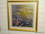 (R2) FRAMED WATER COLOR PRINT OF A POND WITH LILY PADS FLOATING ALONG THE TOP. IS IN A GOLD TONE