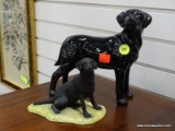 (R2) PAIR OF BLACK LABRADOR FIGURINES (1 IS MADE IN SCOTLAND AND 1 IS MADE IN ENGLAND). ITEM IS SOLD