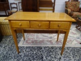 (R2) MAPLE 3 DRAWER DESK WITH WOODEN KNOB STYLE PULLS. MEASURES 40 IN X 19 IN X 30 IN. ITEM IS SOLD