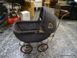 (R2) VINTAGE BLUE WICKER PRAM WITH WOOD AND METAL HANDLE, METAL BASE, AND A WOOD BOTTOM. MEASURES 11