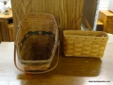 (R2) 2 LONGABERGER BASKET LOT. INCLUDES A SINGLE LEATHER HANDLE BASKET AND A DOUBLE HANDLE BASKET.