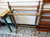 (R2) OAK FINISHED QUILT RACK. MEASURES 11 1/2 N X 25 IN X 39 IN. ITEM IS SOLD AS IS, WHERE IS, WITH