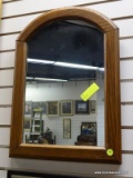 (R1) OAK FRAMED MIRROR WITH BOWED CREST. MEASURES 16 IN X 22 IN. ITEM IS SOLD AS IS WHERE IS WITH NO