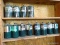 (SHOP) SHELF LOT OF 12 PROPANE TANKS- SOME LOOK TO NEVER BEEN USED. ITEM IS SOLD AS IS WHERE IS WITH