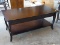 (SHOP) STAINED WALNUT COFFEE TABLE- MATCHES- 195- 43 IN X 20 IN X 18 IN. ITEM IS SOLD AS IS WHERE IS