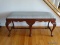 (LR) 6 LEGGED MAHOGANY QUEEN ANNE BENCH WITH SHELL CARVED KNEES AND LIGHT BLUE UPHOLSTERY. MEASURES