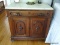 (MBR) ANTIQUE WALNUT VICTORIAN WASHSTAND WITH 1 DRAWER WITH MUSTACHE PULL OVER 2 DOORS AND WHITE