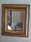 (UPBED 1) ANTIQUE GOLD GILT FRAMED MIRROR. MEASURES 29 IN X 33 IN. ITEM IS SOLD AS IS WHERE IS WITH