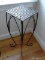 (UPHALL) WROUGHT IRON PLANT STAND WITH BASKET WEAVE PATTERN TOP. MEASURES 10 IN X 10 IN X 27 IN.