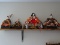(UPBED 2) LOT OF 4 JAPANESE STYLE DOLLS. 2 ARE MEN, 1 IS A WOMAN, AND 1 IS OF A WOMAN SITTING ON A