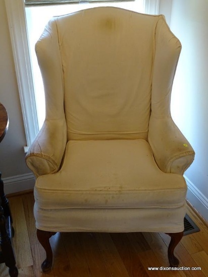 (KIT) OFF-WHITE UPHOLSTERED WING BACK CHAIR WITH MAHOGANY QUEEN ANNE LEGS AND A SLIPCOVER. IS 1 OF A