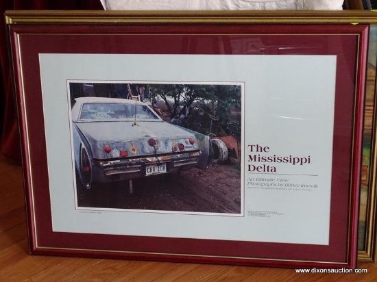 (LR) FRAMED CAR PRINT TITLED "THE MISSISSIPPI DELTA" IN A BURGUNDY FRAME. MEASURES 34 IN X 25 IN.