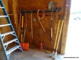 (SHOP) TOOL LOT ON WALL- POST HOLE DIGGER, SHOVEL, RKAE, AX, ETC. ITEM IS SOLD AS IS WHERE IS WITH