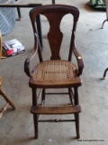(SHOP) OAK YOUTH CHAIR WITH CANE BOTTOM- 15 IN X 16 IN X 37 IN. ITEM IS SOLD AS IS WHERE IS WITH NO