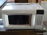 (SHOP) EMEROSN 700 WATT MICROWAVE. ITEM IS SOLD AS IS WHERE IS WITH NO GUARANTEES OR WARRANTY. NO