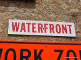 (SHOP) WATERFRONT SIGN- 24 IN X 6 IN. ITEM IS SOLD AS IS WHERE IS WITH NO GUARANTEES OR WARRANTY. NO