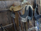 (stall 5) western saddle- leather and jean cloth western saddle. ITEM IS SOLD AS IS WHERE IS WITH NO