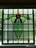 (MBTH) STAINED GLASS WINDOW SITTING PANE. MEASURES 28 IN X 33 IN. HAS A CRACK ON THE LOWER RIGHT