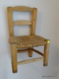 (UPHALL) PEG CONSTRUCTED PINE CHILDS CHAIR WITH RUSH BOTTOM SEAT. MEASURES 13 IN X 10 IN X 20 IN.