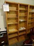 (OFF) SOLID OAK 12 SHELF BOOKCASE. HAS ADJUSTABLE SHELVES. IS 1 OF A PAIR. MEASURES 48 IN X 12 IN X
