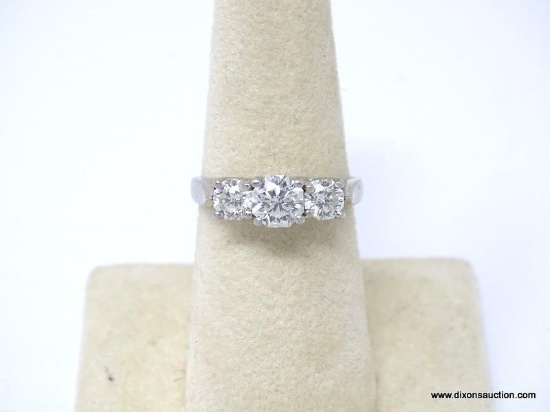 PLATINUM & TRIPLE DIAMOND ENGAGEMENT RING. STAMPED PLAT 0051 WITH THE ZALES DIAMOND INTEGRATED LOGO.