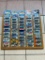 (LOCATED CENTER AISLE) HOT WHEELS CARS IN ORIGINAL PACKAGES IN WOOD DISPLAY RACK. MOSTLY 1990S CARS.