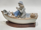 (S6F) PAUL SEBASTIAN FINE PORCELAIN FATHERS DAY FATHER WITH SON AND DOG ON FISHING BOAT FIGURE