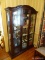 (PARLOR) ONE OF A PR. OF CHERRY 2 DOOR DISPLAY CABINETS, BEVELED GLASS DOORS AND CENTER PANEL WITH