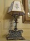 (PARLOR) UNUSUAL BRASS DESK LAMP WITH LETTER HOLDER- GLASS CHIMNEY AND PAPER SHADE- 20 IN H, ITEM IS