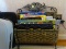 (BCKRM) METAL MAGAZINE RACK, 2 LAPTOP CASES AND LAPTOP PILLOW, ITEM IS SOLD AS IS WHERE IS WITH NO