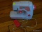 (DR) SMALL ELECTRIC DISCOVERY KIDS SEWING MACHINE IN WHITE AND PINK. ITEM IS SOLD AS IS WHERE IS