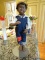 (KIT) AFRICAN AMERICAN MEMORABILIA DOLL IN THE FORM OF A YOUNG BOY WEARING JEAN OVERALLS WITH A RED
