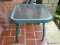 (FRNT PRCH) GREEN METAL AND PLEXIGLASS TOP SQUARE END / SIDE TABLE. MEASURES 21 IN X 21 IN X 18 IN.