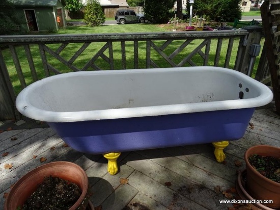 (BCK PRCH) ANTIQUE CAST IRON BATHTUB WITH CAST IRON CLAW FEET. MEASURES 30 IN X 66 IN X 23 IN. ITEM