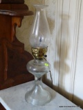 (LANDING) ANTIQUE OIL LAMP CONVERTED TO ELECTRIC WITH CHIMNEY- 19 IN H, ITEM IS SOLD AS IS WHERE IS