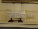 (PARLOR) HAND BLOWN SAILING SHIP IN A BOTTLE FROM NORWAY ON STAND- 13 IN L, ITEM IS SOLD AS IS WHERE