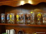 (DR) SET OF 8 WARNER BROS AND LOONEY TUNES THEMED GLASSES. ALSO INCLUDES A NFL SPORTS THEMED GLASS.