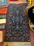 (UPBD1) MACHINE MADE ORIENTAL STYLE RUG IN GREEN, BLUE IVORY AND RED- 23 IN X 52 IN, ITEM IS SOLD AS