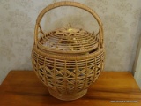 (UPHALL) LIDDED BASKET WITH ROLLS OF CHRISTMAS RIBBONS, ITEM IS SOLD AS IS WHERE IS WITH NO